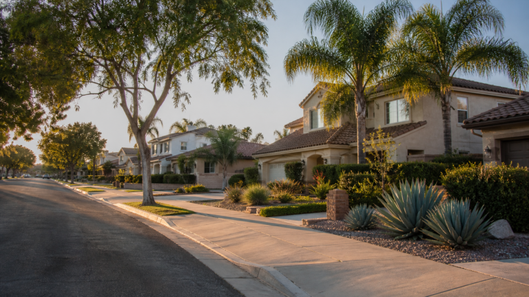 Corona residential street with stucco homes and water-conscious landscaping
